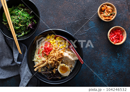 Spicy ramen bowls with noodles, pork and chicken 104246532