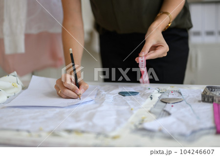 Beautiful woman dressmaker working in workshop studio 104246607