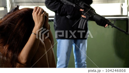 Unknown terrorist or murderer holding gun pointed to the head of unknown victim Unknown terrorist or murderer holding gun pointed to the head of unknown victim 104246808