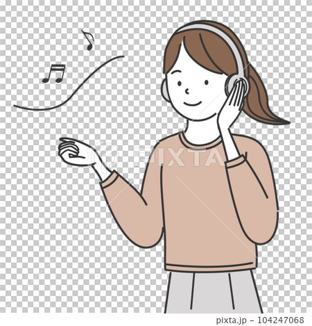 A woman listening to music with headphones 104247068