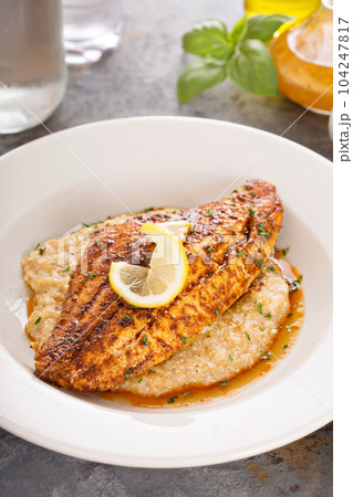 Grits with fried fish Grits with fried fish 104247817