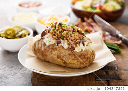 Baked potato with pulled pork Baked potato with pulled pork 104247891