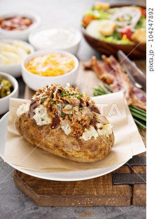 Baked potato with pulled pork 104247892