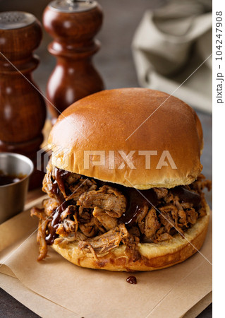 Pulled pork sandwich with bbq sauce Pulled pork sandwich with bbq sauce 104247908