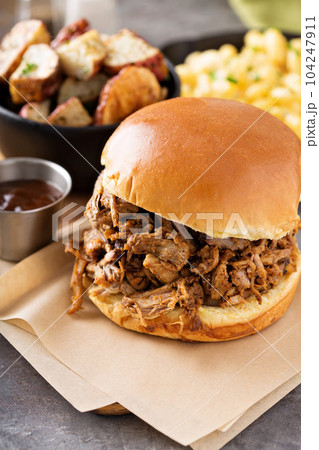 Pulled pork sandwich with bbq sauce Pulled pork sandwich with bbq sauce 104247911
