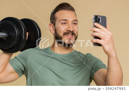Athlete man use smartphone typing new post on web sms message browsing addiction of social networks Athlete man use smartphone typing new post on web sms message browsing addiction of social networks 104247981