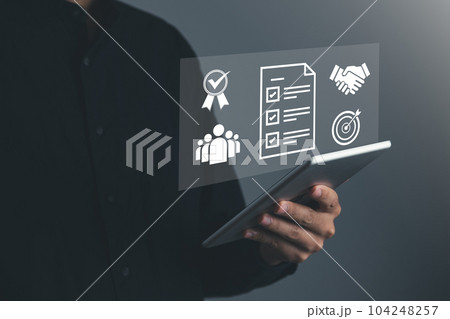 Businessman give the 5 star for best quality score, product warranty, ISO standard and quality assurance concept. 104248257