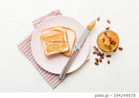 Peanut butter sandwiches or toasts on light table background.Breakfast. Vegetarian food. American cuisine top view vith copy space Peanut butter sandwiches or toasts on light table background.Breakfast. Vegetarian food. American cuisine top view vith copy space 104249878
