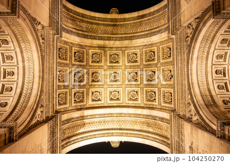 Detailed view of Arc de Triomphe from bottom by night, Paris, France 104250270