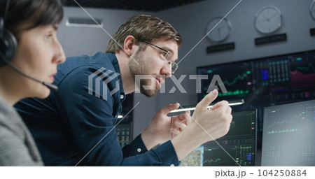 Female financial analyst and investment manager discuss real-time stocks data Female financial analyst and investment manager discuss real-time stocks data 104250884