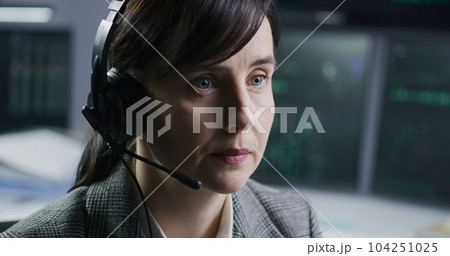 Face close up of female stock trader in headset 104251025