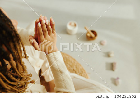 Closeup of female hands during meditation. 104251802
