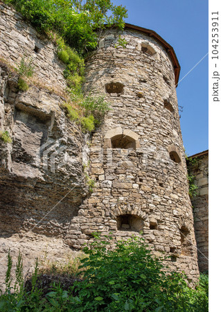 Old stone medieval Russian Gate tower in Kamianets-Podilskyi fortress, Ukraine. 104253911