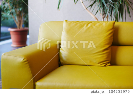 modern yellow sofa with pillows in living room at home modern yellow sofa with pillows in living room at home 104253979