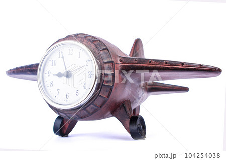 Clock in the form of a wooden plane, isolate on a white background Clock in the form of a wooden plane, isolate on a white background 104254038