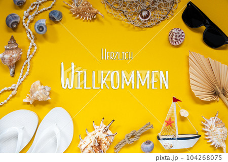 Yellow Summer Flat Lay With Accessories, Willkommen Means Welcome Yellow Summer Flat Lay With Accessories, Willkommen Means Welcome 104268075