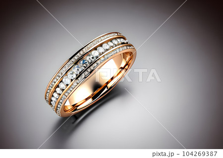 stunning close up shot of a single wedding rings, delicately intertwined to symbolize the everlasting bond of love and commitment. Jewelry gold diamond ring for anniversary, valentine, or engagement. stunning close up shot of a single wedding rings, delicately intertwined to symbolize the everlasting bond of love and commitment. Jewelry gold diamond ring for anniversary, valentine, or engagement. 104269387