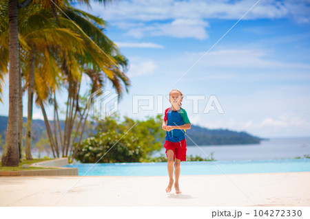Kids jump into swimming pool. Summer water fun. Kids jump into swimming pool. Summer water fun. 104272330