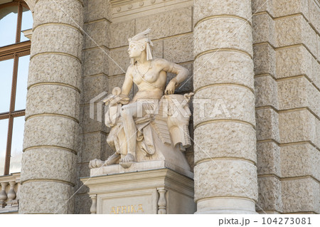 Sculpture woman and sphinx on a building in Austria in Vienna, text in German Afrika Sculpture woman and sphinx on a building in Austria in Vienna, text in German Afrika 104273081