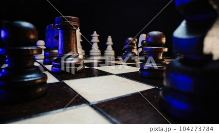 Chess pieces on wooden chessboard before party competition. Board strategy game. Chess pieces on wooden chessboard before party competition. Board strategy game. 104273784