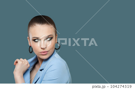Nice lady portrait. Pretty woman brunette on blue background Nice lady portrait. Pretty woman brunette on blue background 104274319