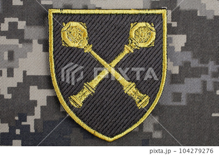 KYIV, UKRAINE - October 5, 2022. Russian invasion in Ukraine 2022. Ukraine Army Commander in Chief of the Armed Forces of Ukraine uniform shoulder sleeve insignia badge. KYIV, UKRAINE - October 5, 2022. Russian invasion in Ukraine 2022. Ukraine Army Commander in Chief of the Armed Forces of Ukraine uniform shoulder sleeve insignia badge. 104279276