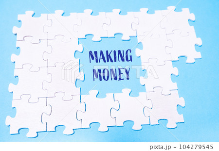 white puzzles on a blue background with the text MAKING MONEY white puzzles on a blue background with the text MAKING MONEY 104279545