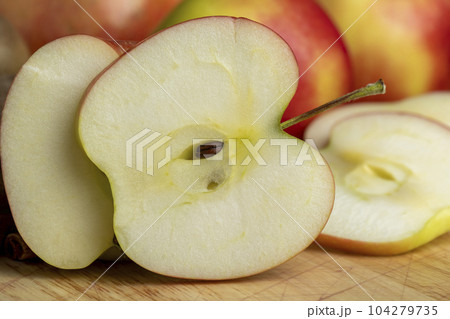 Sliced apple on a chopping board, close up Sliced apple on a chopping board, close up 104279735