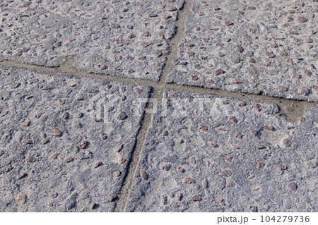 old concrete decorative road made of concrete and rubble 104279736