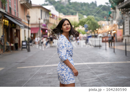 Beautiful young mixed race woman in the old town of Nice, France Beautiful young mixed race woman in the old town of Nice, France 104280590