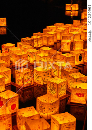 Lanterns floating down stream at Japanese lantern festival 104280961