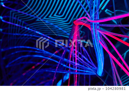 Vibrant background of LED neon lights crisscrossing Vibrant background of LED neon lights crisscrossing 104280981