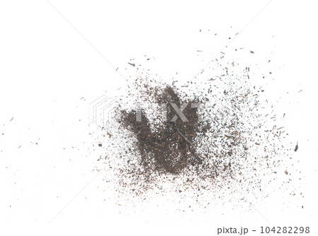 Black dried leave Tea explode. Small Fine size tea leaf flying explosion, Abstract cloud fly. Brown colored Teas splash throwing in Air. White background Isolated high speed shutter, throwing freeze 104282298
