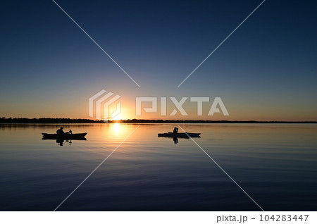 Two kayaks on Coot Bay in Everglades National Park, Florida at sunset. 104283447