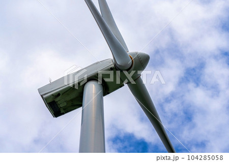 Close up of Wind turbine generating electricity clean energy with cloud background on the sky. Clean energy concept. 104285058