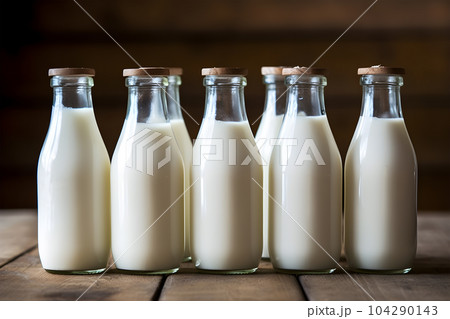 Glass bottles of fresh milk stand out, looking lovely and tasty Glass bottles of fresh milk stand out, looking lovely and tasty 104290143