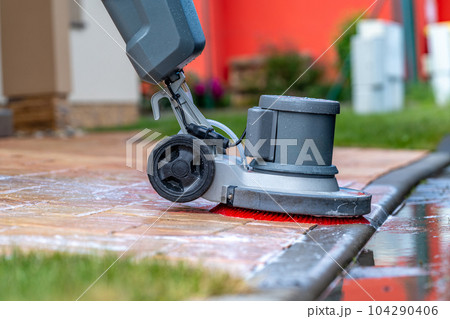 manual cleaning of concrete and stone pavements with a mechanical brush and foam 104290406