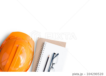 Top view with orange safety engineer helmet and blank notebook 104290520