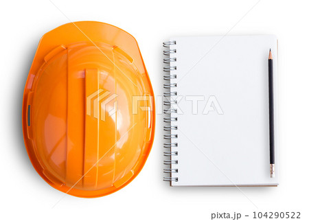 Top view with orange safety engineer helmet and blank notebook on white background 104290522