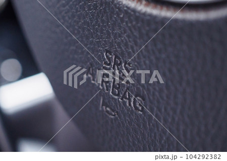 Safety airbag sign on car steering wheel with horn icon Safety airbag sign on car steering wheel with horn icon 104292382