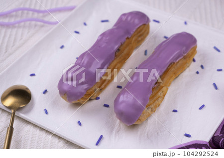 Composition of two eclair cakes in trendy colors 2022 Very Peri. High quality 4k footage Composition of two eclair cakes in trendy colors 2022 Very Peri. High quality 4k footage 104292524