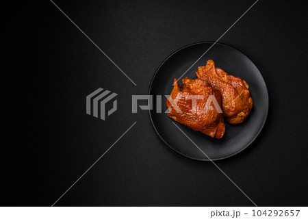 Delicious fried or smoked chicken thighs grilled with spices and herbs Delicious fried or smoked chicken thighs grilled with spices and herbs 104292657
