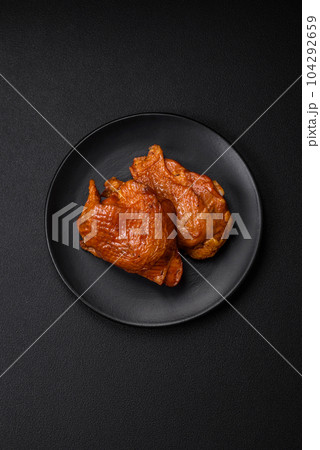 Delicious fried or smoked chicken thighs grilled with spices and herbs Delicious fried or smoked chicken thighs grilled with spices and herbs 104292659