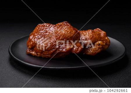 Delicious fried or smoked chicken thighs grilled with spices and herbs Delicious fried or smoked chicken thighs grilled with spices and herbs 104292661