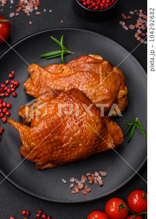 Delicious fried or smoked chicken thighs grilled with spices and herbs Delicious fried or smoked chicken thighs grilled with spices and herbs 104292682