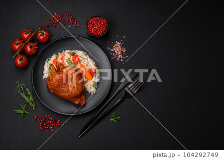 Delicious boiled rice with chicken and vegetables or risotto with salt, spices and herbs 104292749