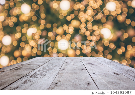 Wood table top with abstract christmas holiday festive bokeh light on tree blurred background for montage product display 104293097