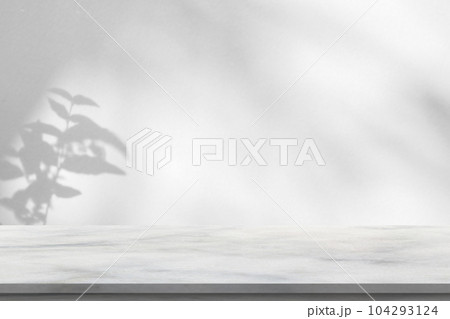 Marble table with tree shadow drop on white wall background for mockup product display 104293124