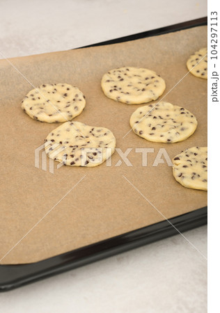 american classic chocolate chip cookies on a baking sheet ready to bake. home made raw cookies, pastry for dessert.  104297113
