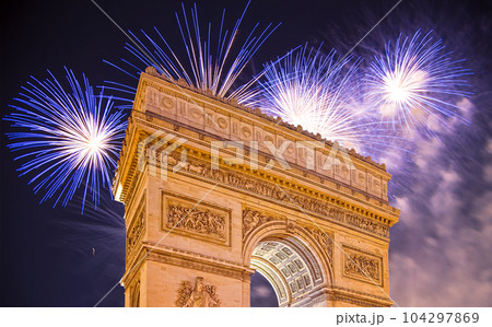 Celebratory colorful fireworks over the Arc de Triomphe, Paris, France 104297869